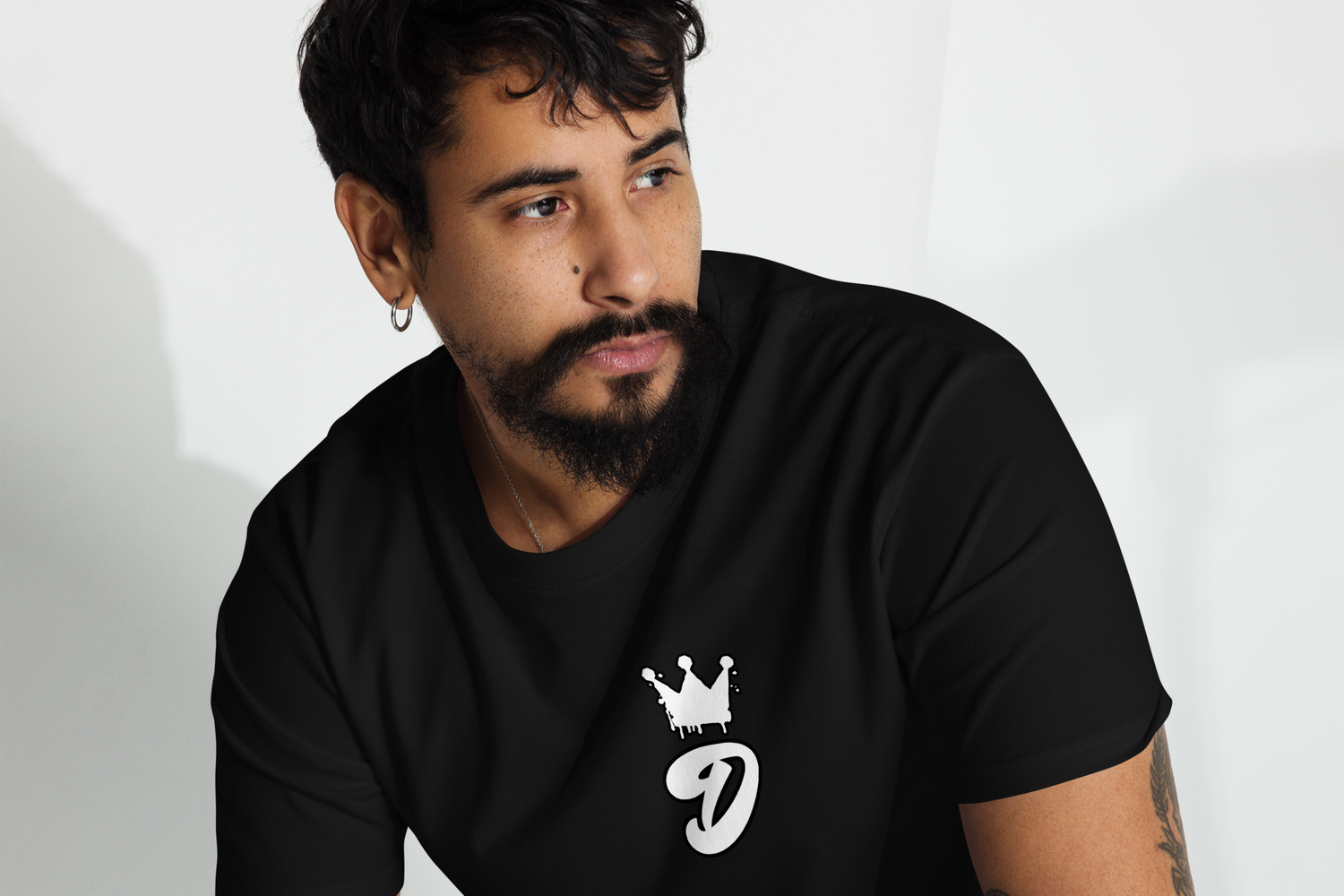 Man wearing a Black Graphic Logo T-Shirt